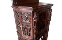 Antique credenza or hall cupboard in walnut in the Neo-Gothic style. French. Signed A. Bastet, Lyon. French antique furniture