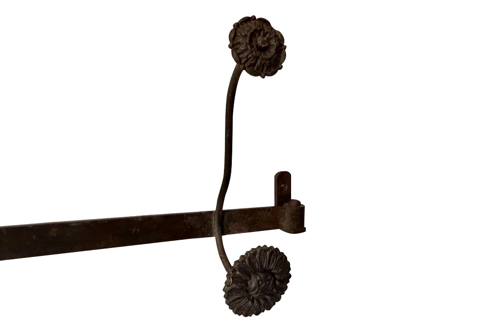 Long French iron coat & hat rack with 4 double flower hooks.