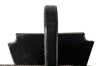 20th century stitched black leather with brass studs magazine holder by Jacques Adnet.