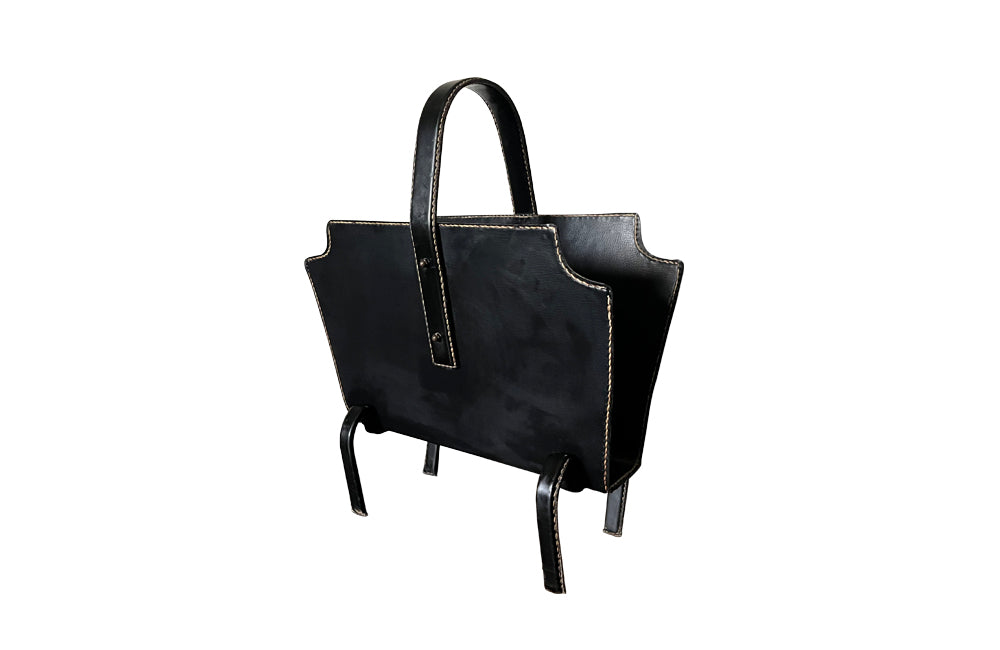 20th century stitched black leather with brass studs magazine holder by Jacques Adnet.