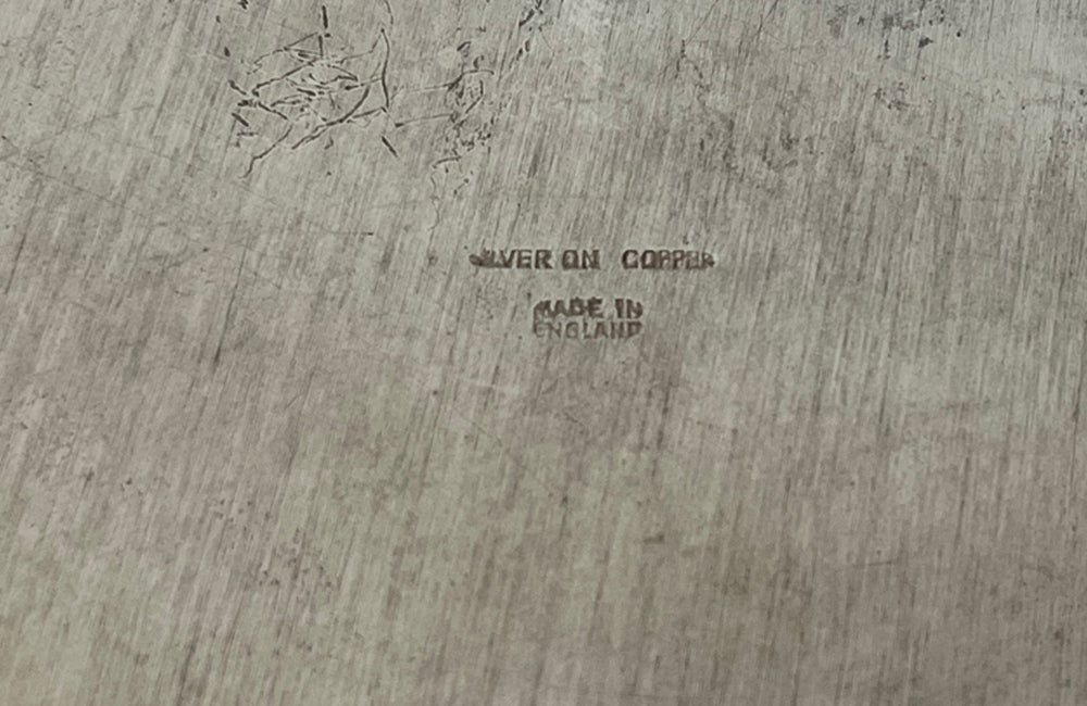 Early 20th Century English nicely worn silverplate footed punch bowl or champagne cooler with lion head ring handles and gadroon rim.