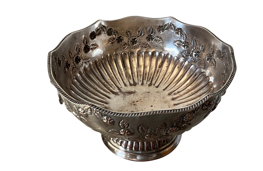 Early 20th Century English nicely worn silverplate footed punch bowl or champagne cooler with lion head ring handles and gadroon rim.