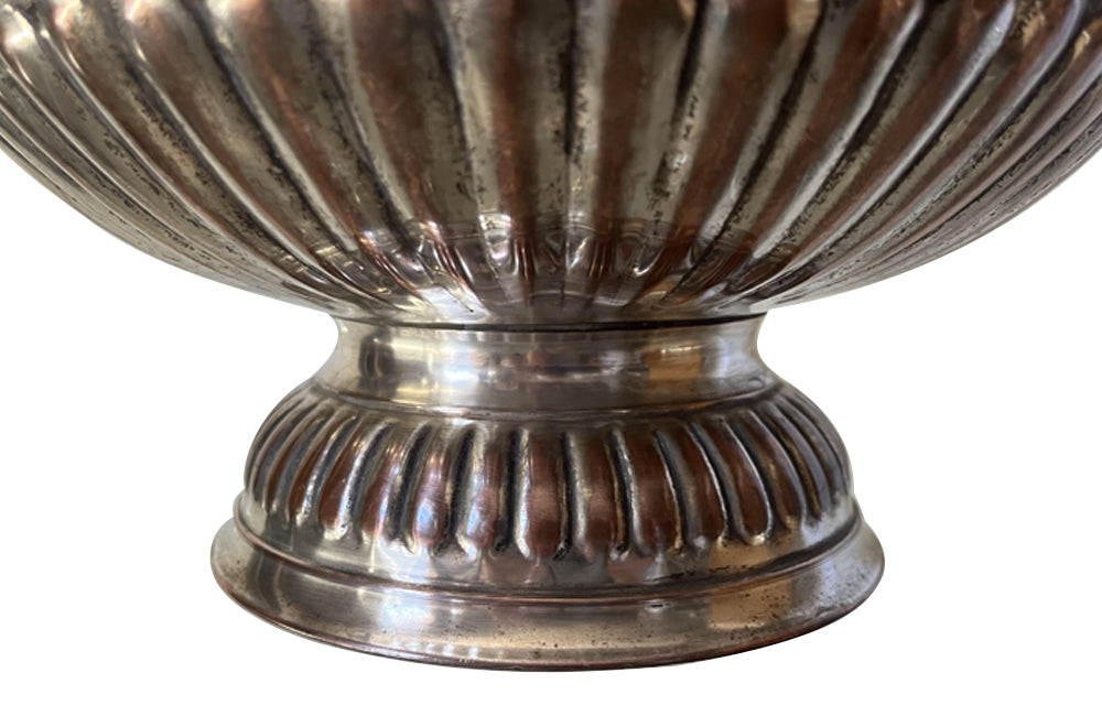 Early 20th Century English nicely worn silverplate footed punch bowl or champagne cooler with lion head ring handles and gadroon rim.