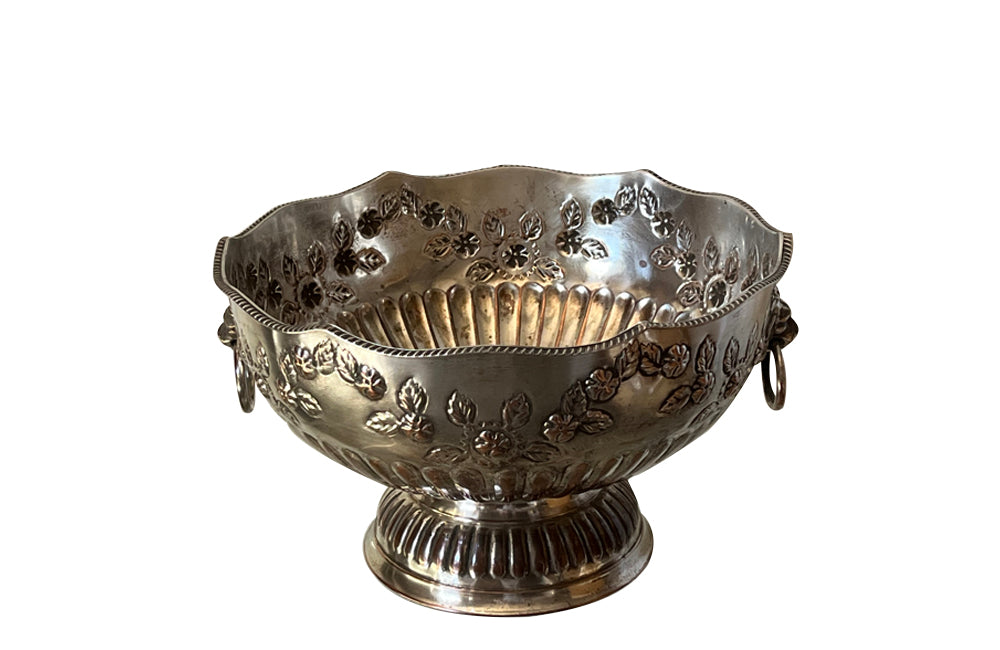 Early 20th Century English nicely worn silverplate footed punch bowl or champagne cooler with lion head ring handles and gadroon rim.