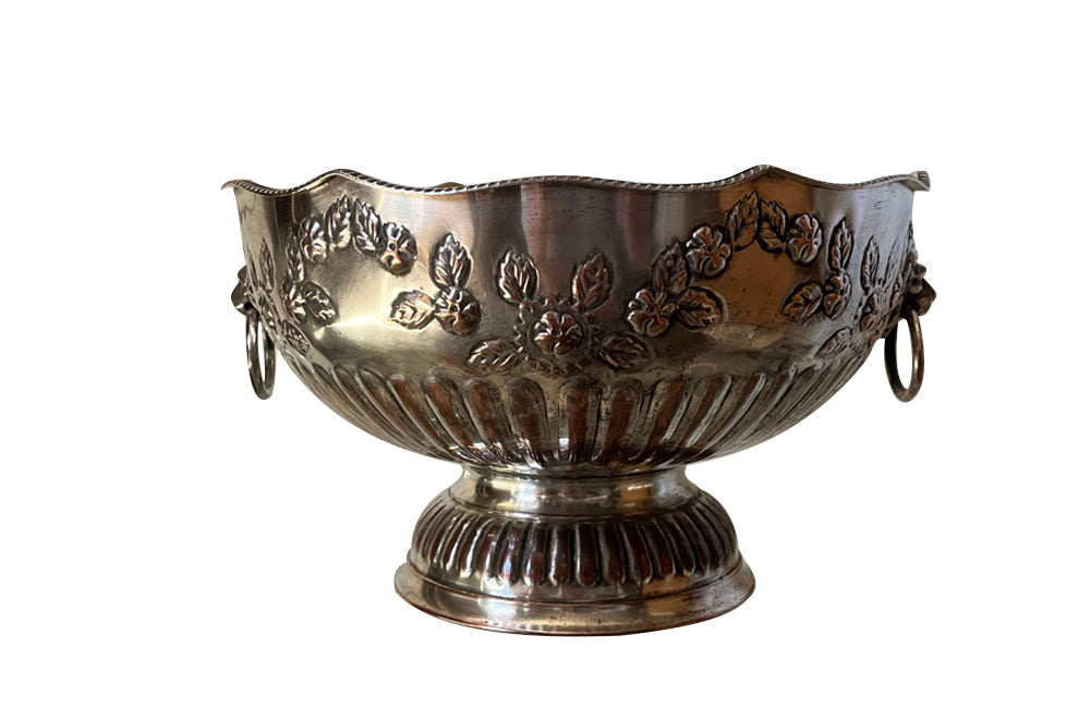 Early 20th Century English nicely worn silverplate footed punch bowl or champagne cooler with lion head ring handles and gadroon rim.