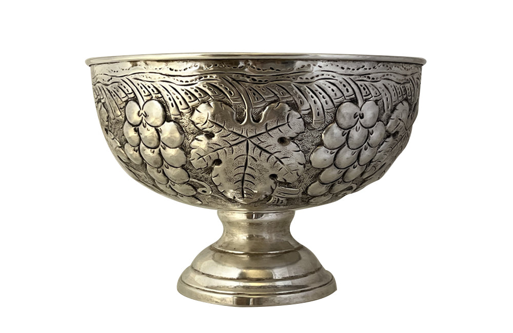20th Century French large silverplate champagne bucket with repousse grape vine decoration.