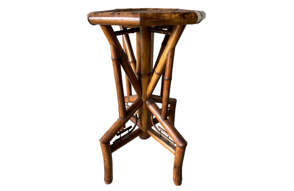 Aesthetic Movement bamboo occasional table with leathered Chinoiserie top embossed with a parrot, floral and foliate decoration. Circa 1900