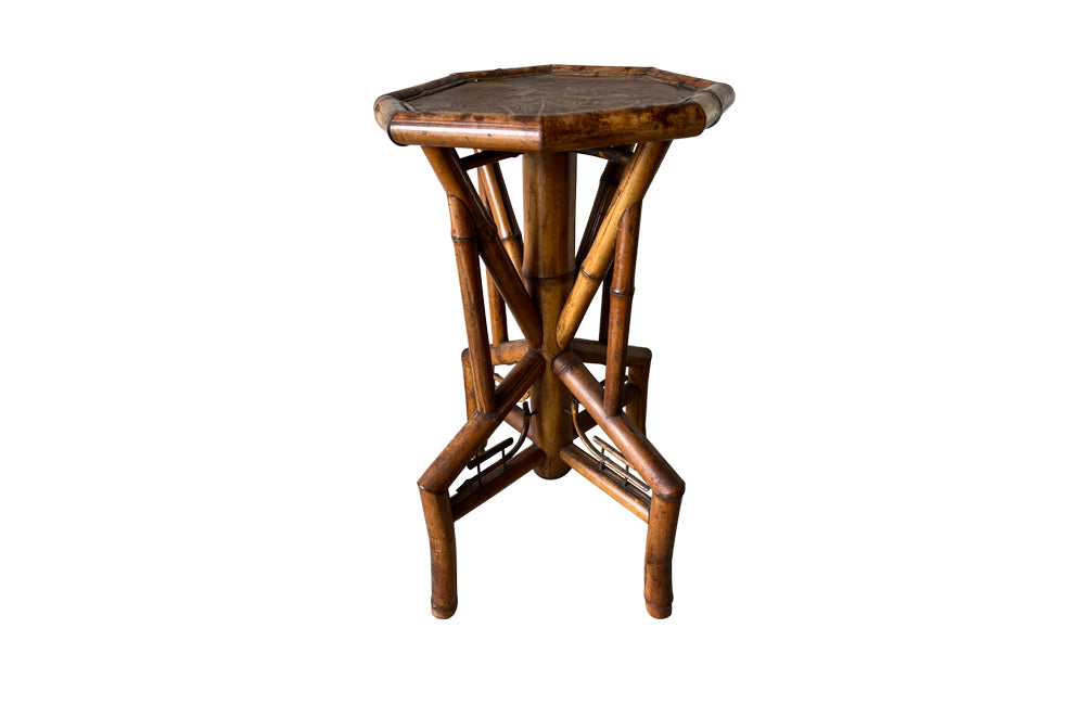 Aesthetic Movement bamboo occasional table with leathered Chinoiserie top embossed with a parrot, floral and foliate decoration. Circa 1900