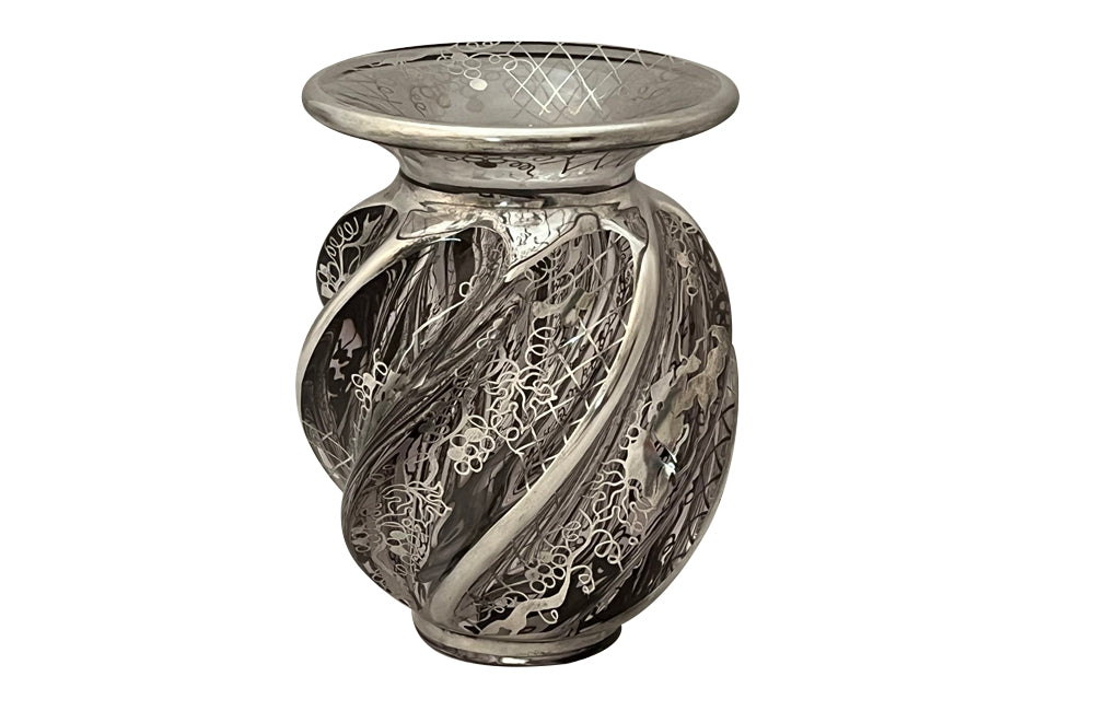 Beautiful mid century crystal vase with silver overlay by the renown French glass makers Saint Graal of swirl form decorated with grape vine and trellis motifs.