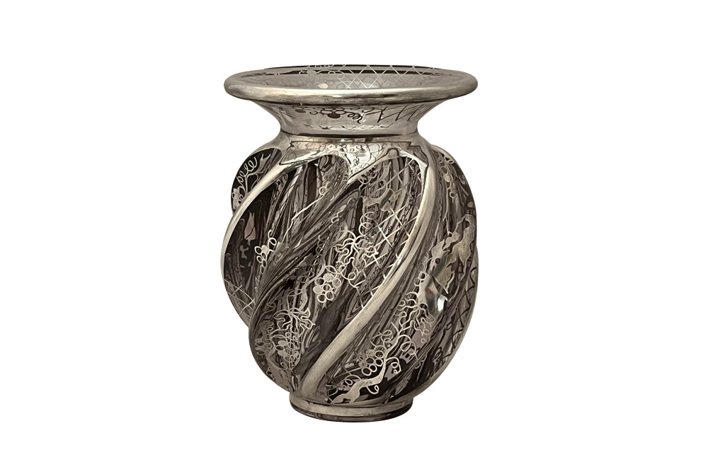 Beautiful mid century crystal vase with silver overlay by the renown French glass makers Saint Graal of swirl form decorated with grape vine and trellis motifs.