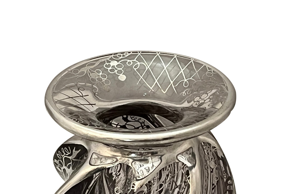 Beautiful mid century crystal vase with silver overlay by the renown French glass makers Saint Graal of swirl form decorated with grape vine and trellis motifs.