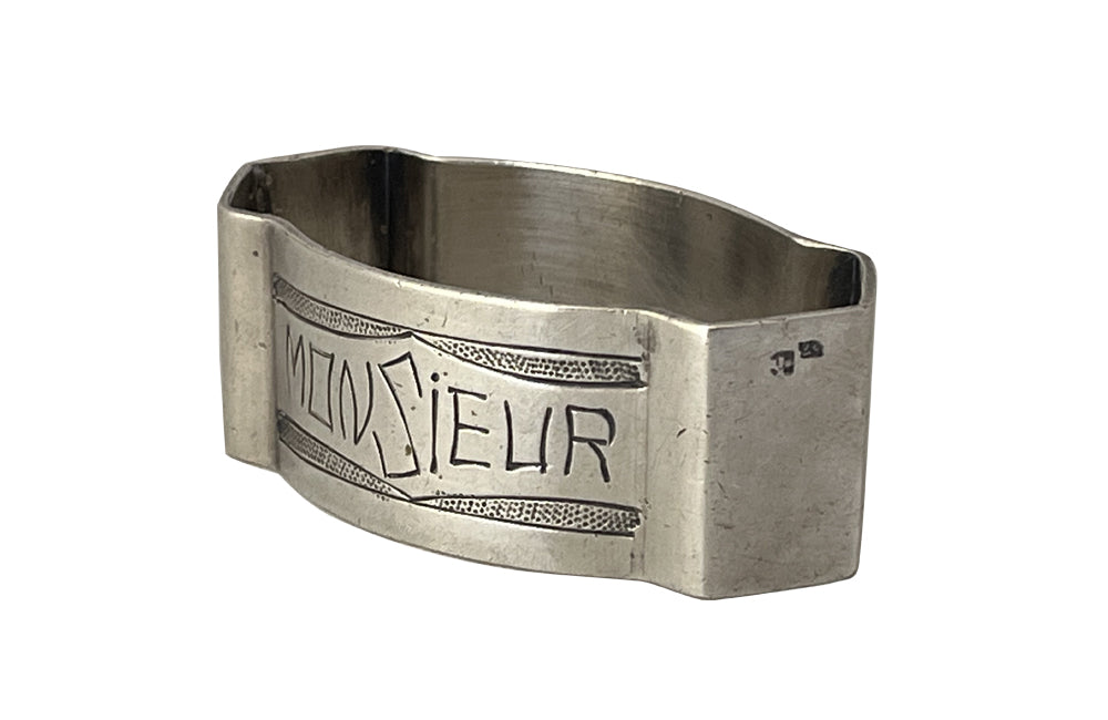 20th Century French silverplate napkin ring engraved 'Monsieur' with stylised garland above and below.