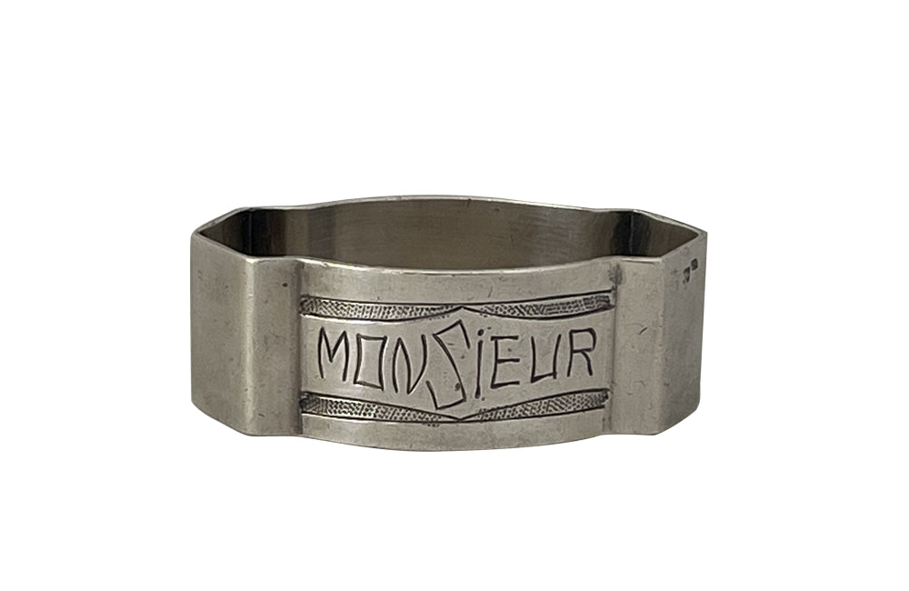 20th Century French silverplate napkin ring engraved 'Monsieur' with stylised garland above and below.