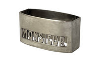 20th Century French silverplate napkin ring with cut-out 'Monsieur' lettering.