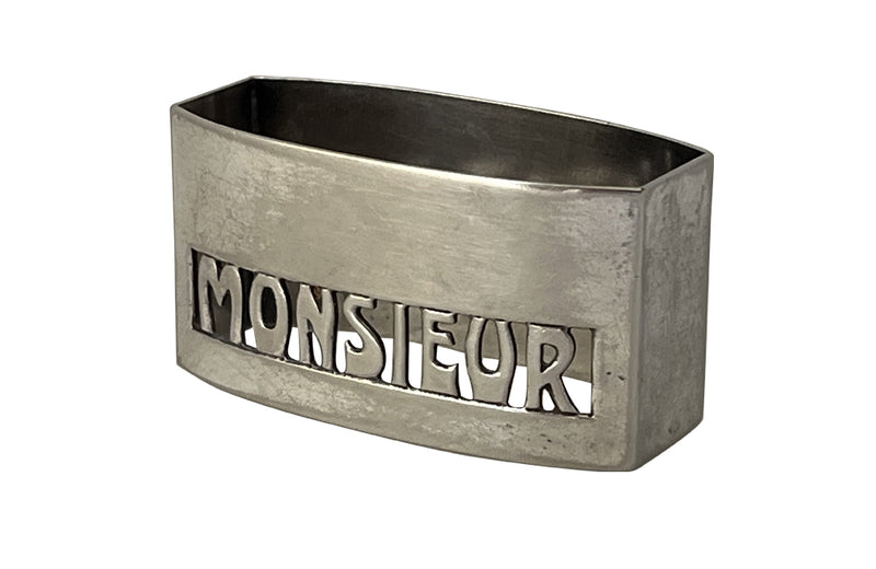 20th Century French silverplate napkin ring with cut-out 'Monsieur' lettering. 