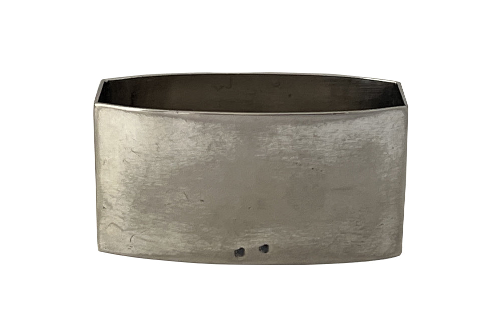 20th Century French silverplate napkin ring with cut-out 'Monsieur' lettering.