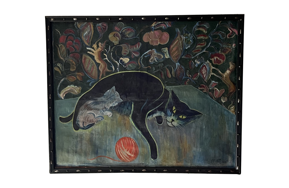 Large 20th Century framed oil on canvas painting of a reclining black cat with her kitten and a ball of wool on a table.