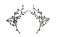 Beautiful pair of early 20th century French large hand wrought iron wall decorations with floral and foliate ornamentation, each in the form of a branching flowering plant.