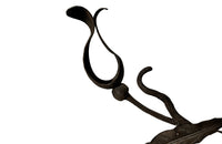 Beautiful pair of early 20th century French large hand wrought iron wall decorations with floral and foliate ornamentation, each in the form of a branching flowering plant.