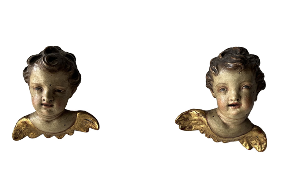 Pair of Italian Antique carved angel heads with wings.