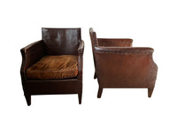 Charming little pair of club chairs with their origianl feather filled cushions circa 1920