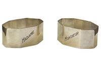 Very stylish pair of octgonal silver plate napkin rings with engraved Madame & Monsieur block letter lettering.