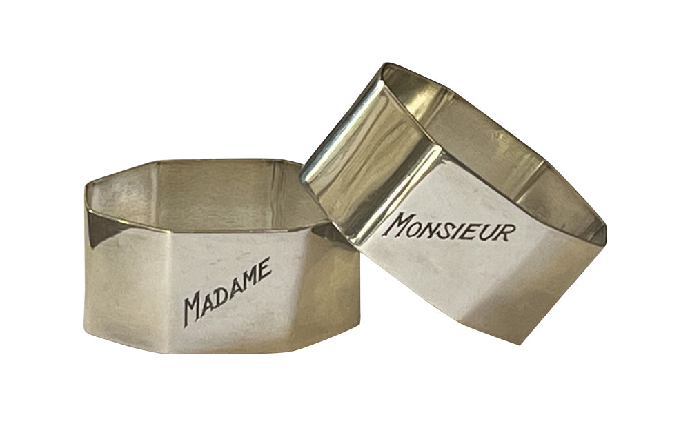 Very stylish pair of octgonal silver plate napkin rings with engraved Madame & Monsieur block letter lettering.