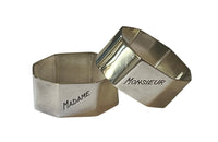 Very stylish pair of octgonal silver plate napkin rings with engraved Madame & Monsieur block letter lettering.