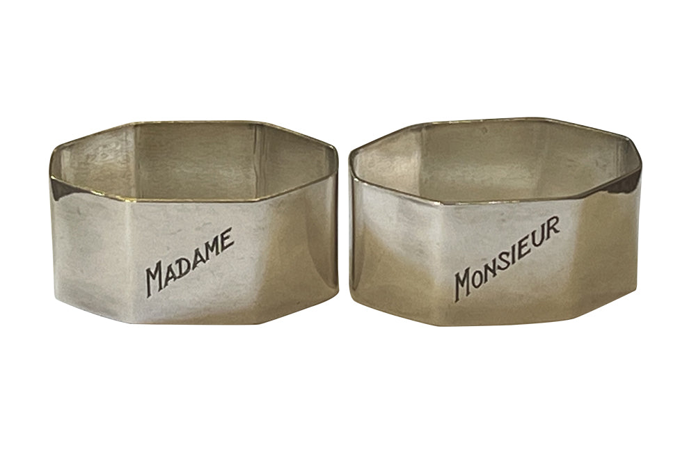 Very stylish pair of octgonal silver plate napkin rings with engraved Madame & Monsieur block letter lettering.
