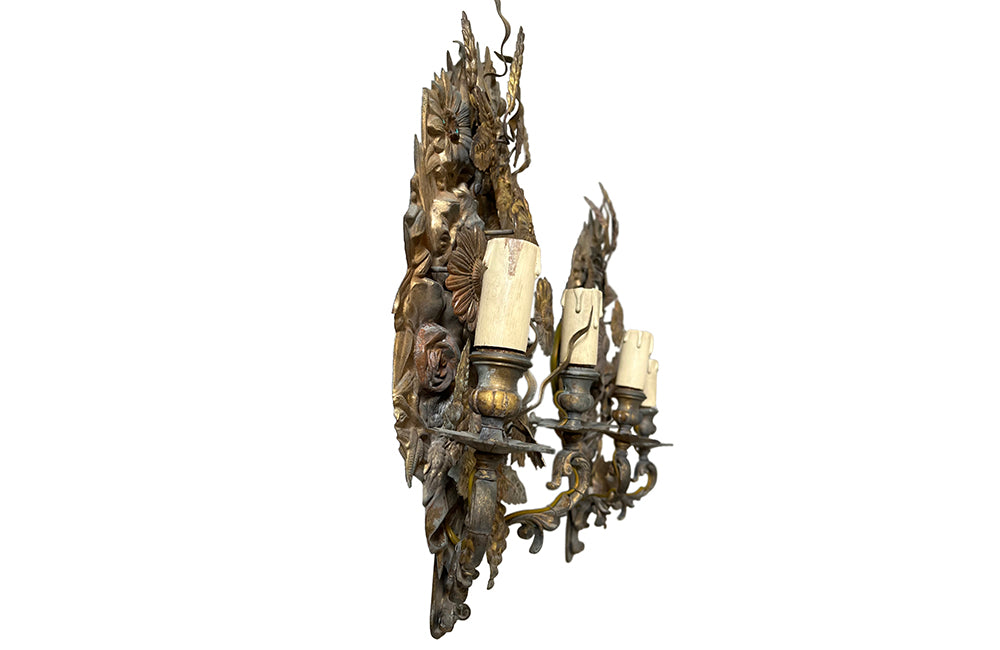 Pretty pair of French tole and pressed brass two branched wall lights decorated with flowers, ivy, grapes and wheat.