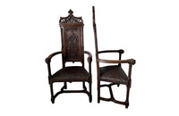 Pair of tall French oak ornately carved armchairs in the Neo-Gothique style.