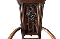 Pair of tall French oak ornately carved armchairs in the Neo-Gothique style.