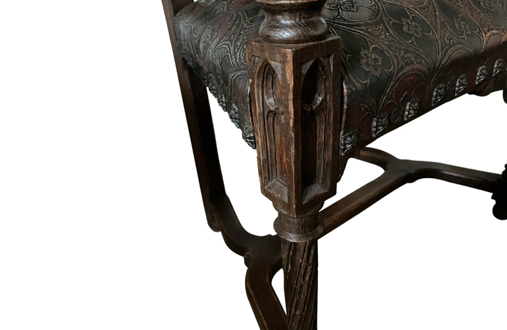 Pair of tall French oak ornately carved armchairs in the Neo-Gothique style.