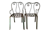 quirky pair of iron garden chairs  circa 1900