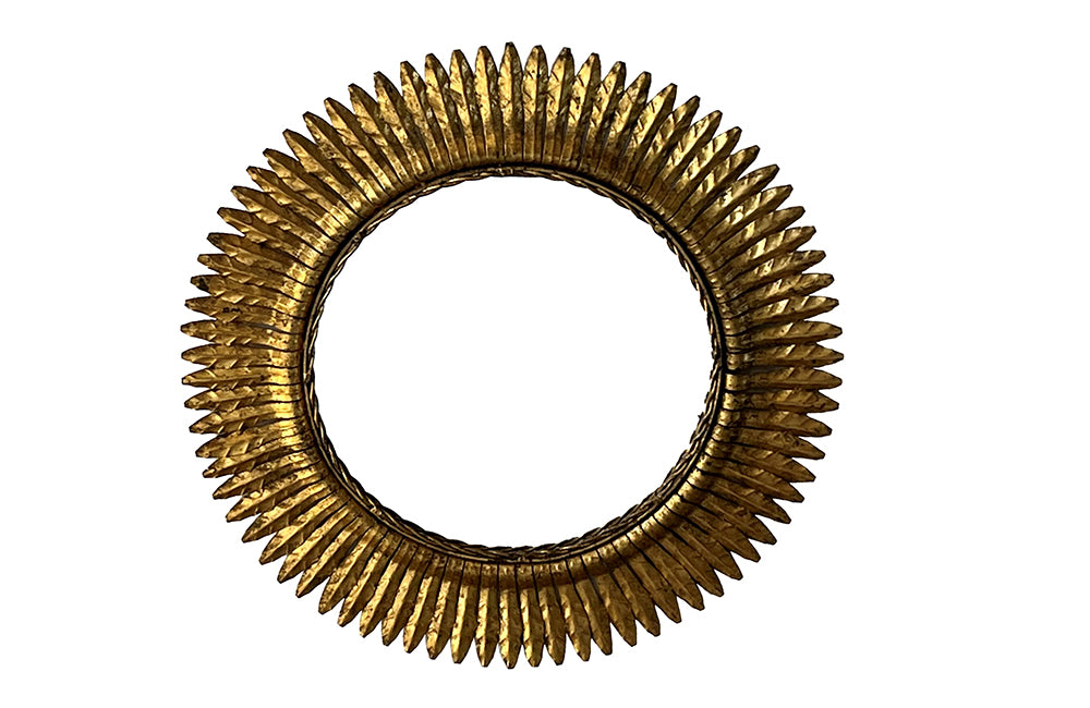 round gilt iron mirror in the form of a sun. Spain c.1970