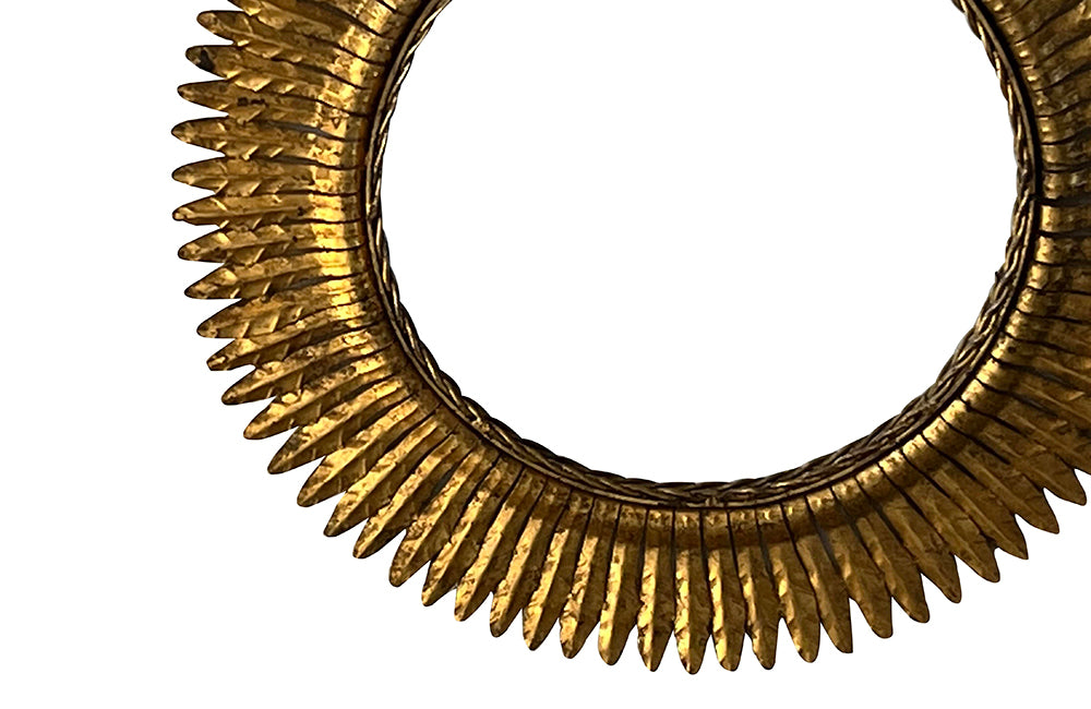 round gilt iron mirror in the form of a sun. Spain c.1970