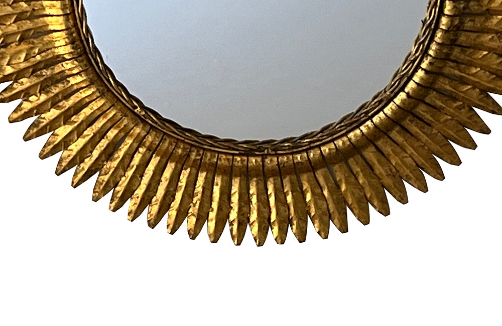 round gilt iron mirror in the form of a sun. Spain c.1970