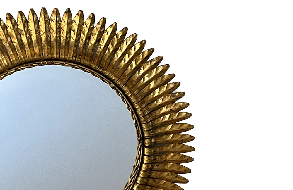 round gilt iron mirror in the form of a sun. Spain c.1970