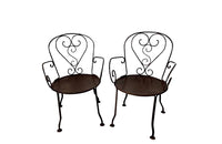 set of four French antique wrought iron garden chairs, comprising two armchairs and two chairs. Each has lovely scrolled ironwork and pierced iron seats. Circa 1900