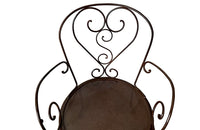 set of four French antique wrought iron garden chairs, comprising two armchairs and two chairs. Each has lovely scrolled ironwork and pierced iron seats. Circa 1900