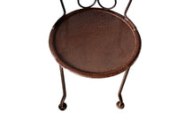 set of four French antique wrought iron garden chairs, comprising two armchairs and two chairs. Each has lovely scrolled ironwork and pierced iron seats. Circa 1900