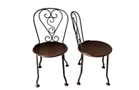 set of four French antique wrought iron garden chairs, comprising two armchairs and two chairs. Each has lovely scrolled ironwork and pierced iron seats. Circa 1900