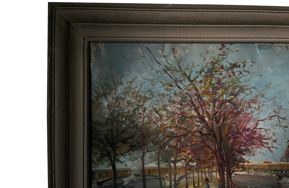 20th century signed, unrestored oil on canvas painting of the Eiffel Tower with a pair of Parisian lovers under an avenue of trees in Autumnal leaf along the River Seine.