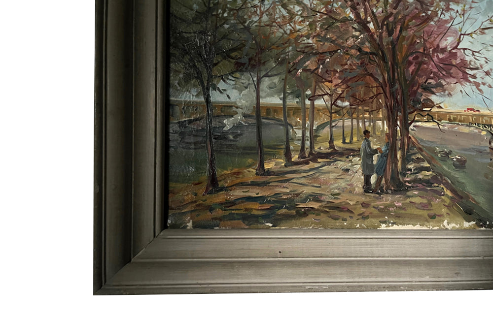 20th century signed, unrestored oil on canvas painting of the Eiffel Tower with a pair of Parisian lovers under an avenue of trees in Autumnal leaf along the River Seine.