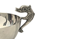 Decorative silver plate bowl with dolphin handles on raised foot and stamped with makers mark B.R.