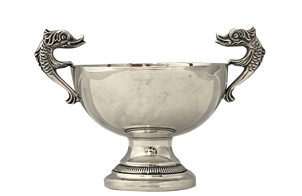 Decorative silver plate bowl with dolphin handles on raised foot and stamped with makers mark B.R.