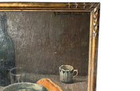 Lovely, French still life painting of fried eggs in a pan, a carafe of water, bottle of wine, glass, loaf of bread, ceramic cup and cloth napkin.