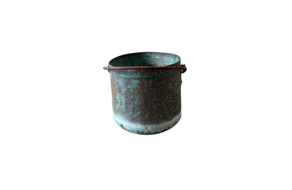 French copper vat planter with banded decoration and iron swing handle.  Drainage holes for planter use with lovely natural verdigris patination.  Early 1900s. AD & PS Antiques