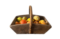 Antique wooden harvest panier filled with marble trompe l'oeil lemons, limes, oranges and mandarins.Italian