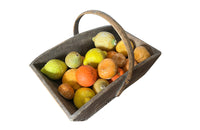Antique wooden harvest panier filled with marble trompe l'oeil lemons, limes, oranges and mandarins.Italian